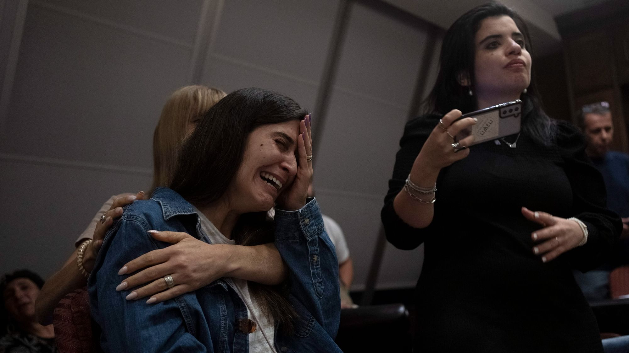 <div class="paragraphs"><p>A relative of an Israeli missing since a surprise attack by Hamas militants near the Gaza border is overcome by emotion during a press conference in Ramat Gan, Israel.</p></div>