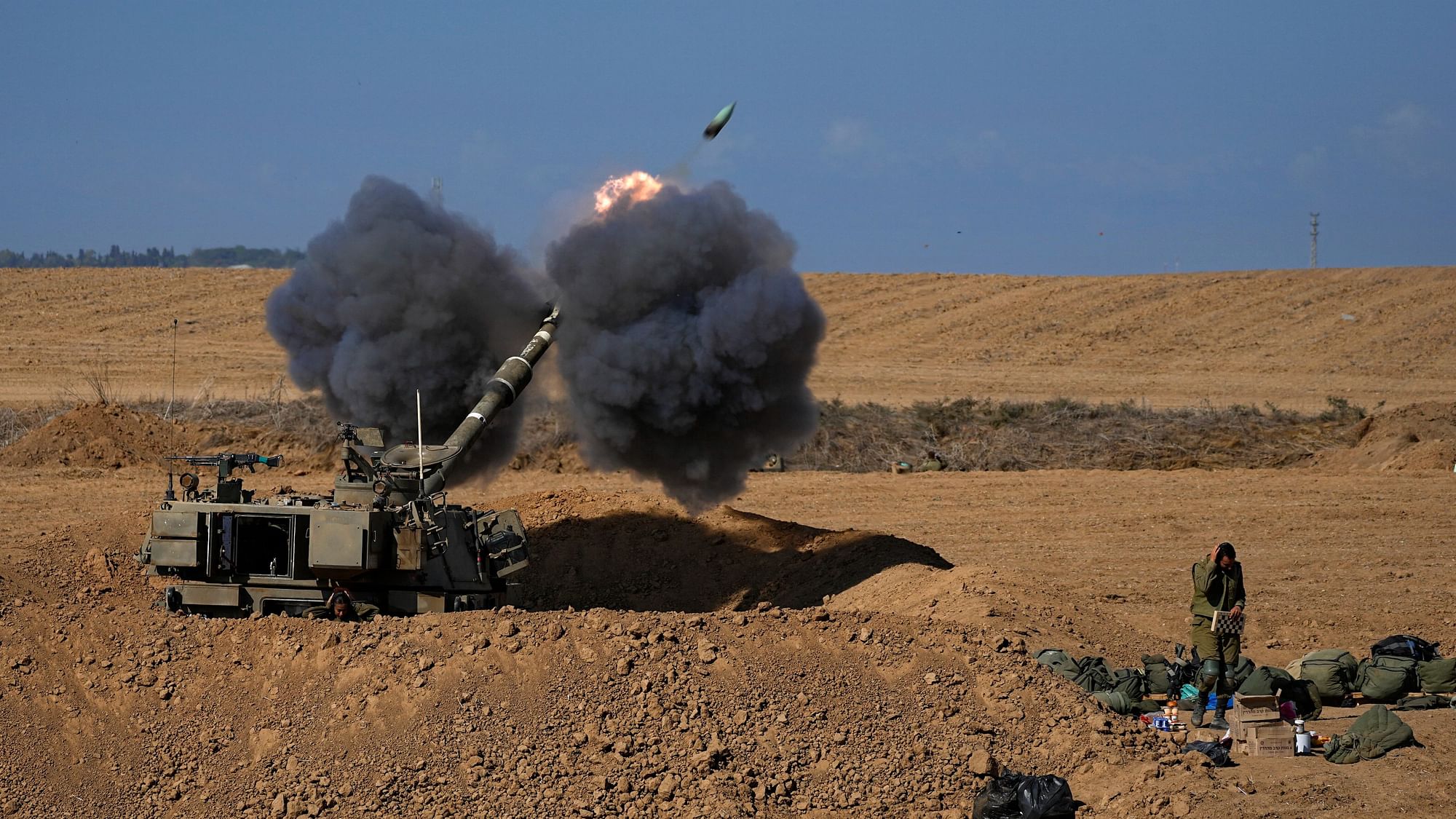 <div class="paragraphs"><p>An Israeli mobile artillery unit fires a shell from southern Israel towards the Gaza Strip on Sunday, 15 October. </p></div>