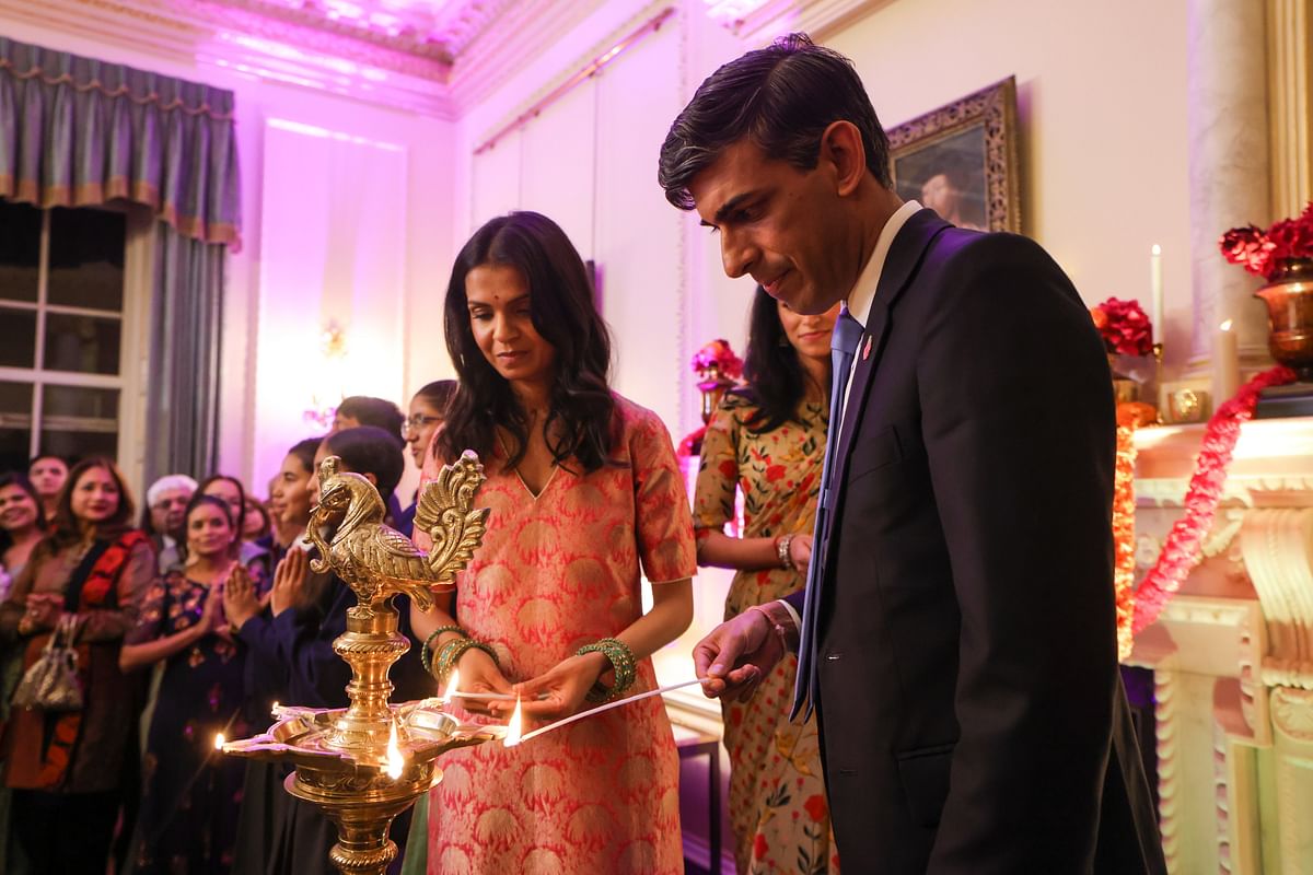 Images showed Rishi Sunak and his wife Akshata Murthy lighting diyas while being surrounded by guests.