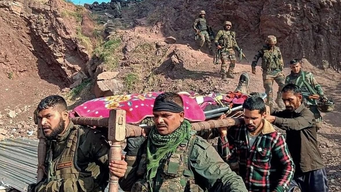 <div class="paragraphs"><p>Army personnel and locals carry the body of an army officer near the site of an encounter with terrorists at Kalakote area, in Rajouri district, on Nov. 22, 2023.</p></div>