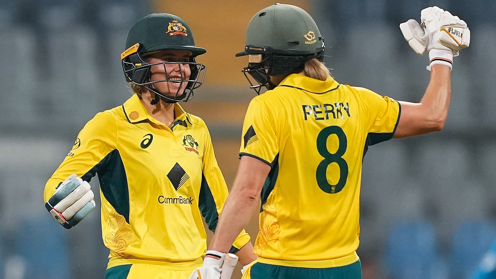 <div class="paragraphs"><p>Australian batter Phoebe Litchfield celebrates with teammate Ellyse Perry after her half century during the first ODI cricket match between India and Australia, at the Wankhede Stadium in Mumbai, Thursday, Dec. 28, 2023.</p></div>