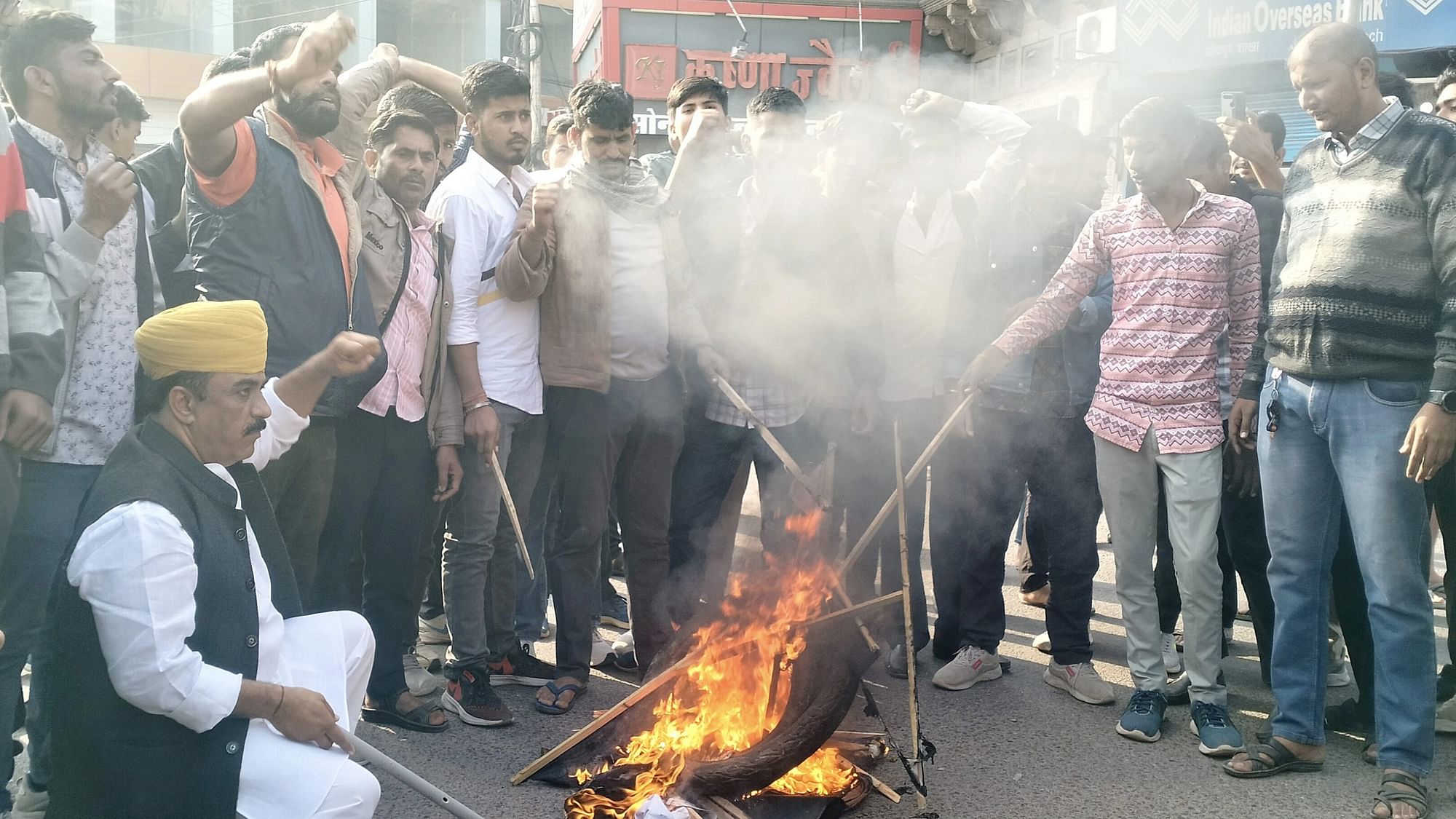 <div class="paragraphs"><p>The supporters of Rajput leader Sukhdev Singh Gogamedi burn tyres on Wednesday, 6 December, a day after he was shot dead at his Jaipur residence.&nbsp;</p></div>