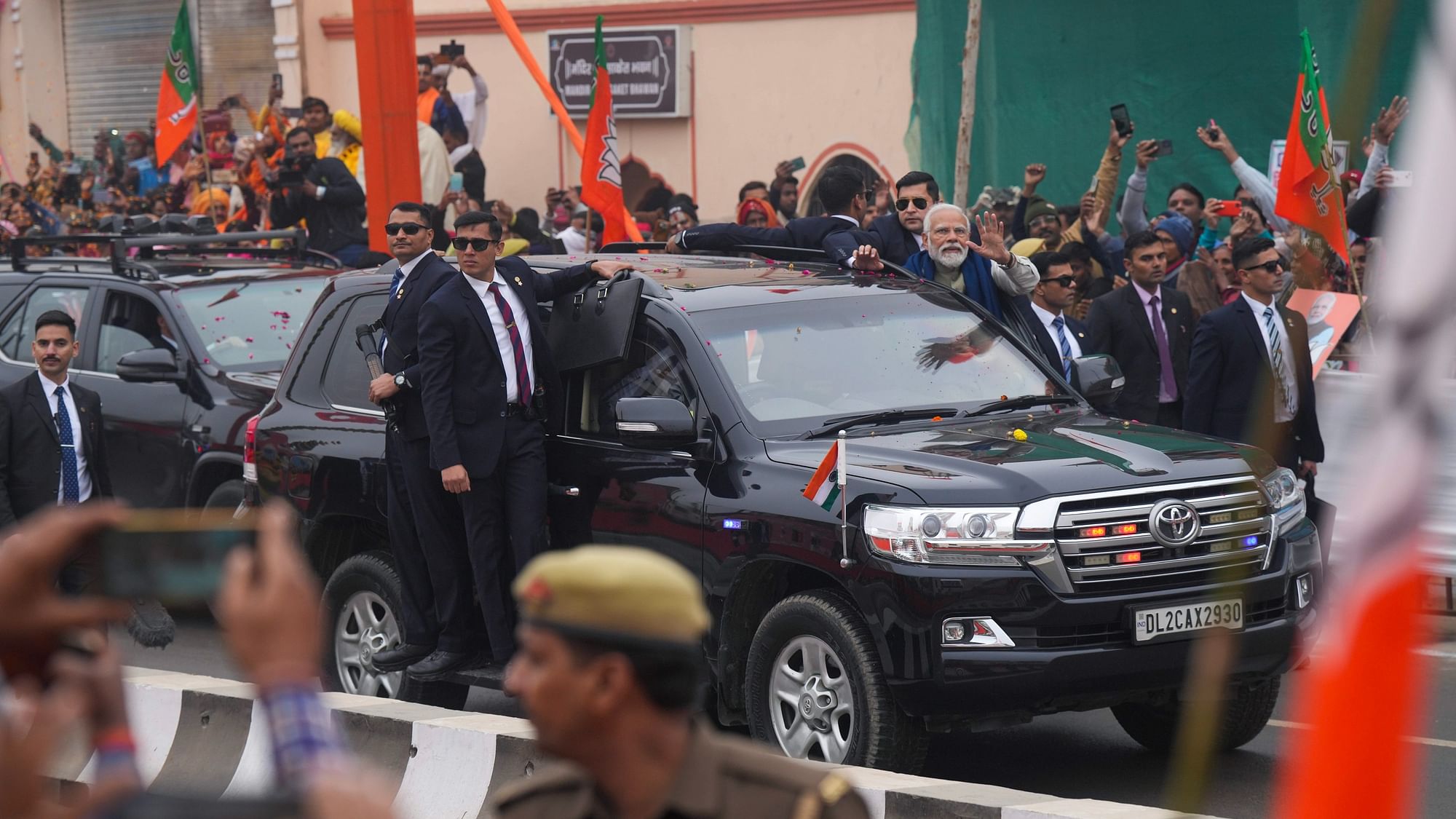 <div class="paragraphs"><p>Prime Minister Narendra Modi waves to the gathering during a roadshow ahead of the inauguration of a redeveloped station and a newly-built airport, in Ayodhya, on Saturday,30 December.</p></div>