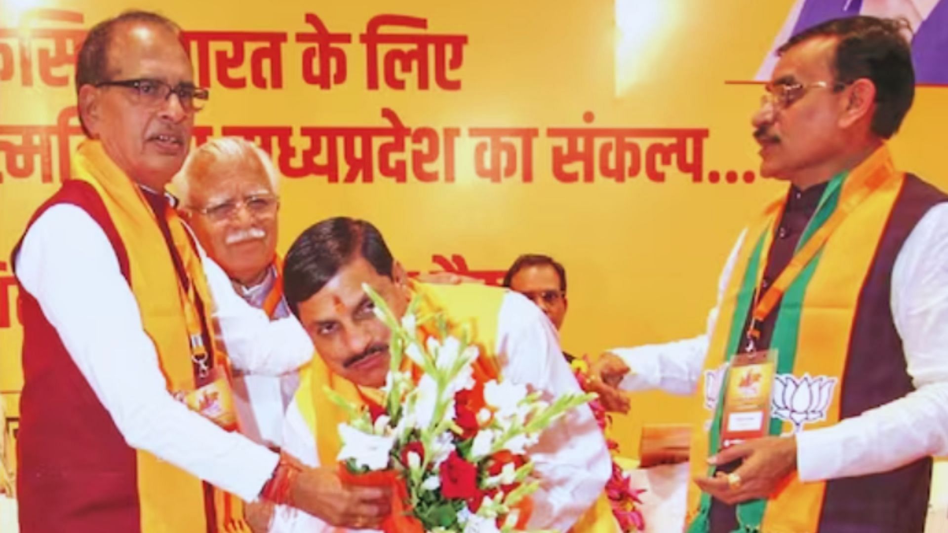 <div class="paragraphs"><p>CM-Designate Mohan Yadav (Centre) Touches The Feet Of Incumbent Shivraj Singh Chouhan After BJP’s Legislature Party Meet, In Bhopal, On Monday.</p></div>