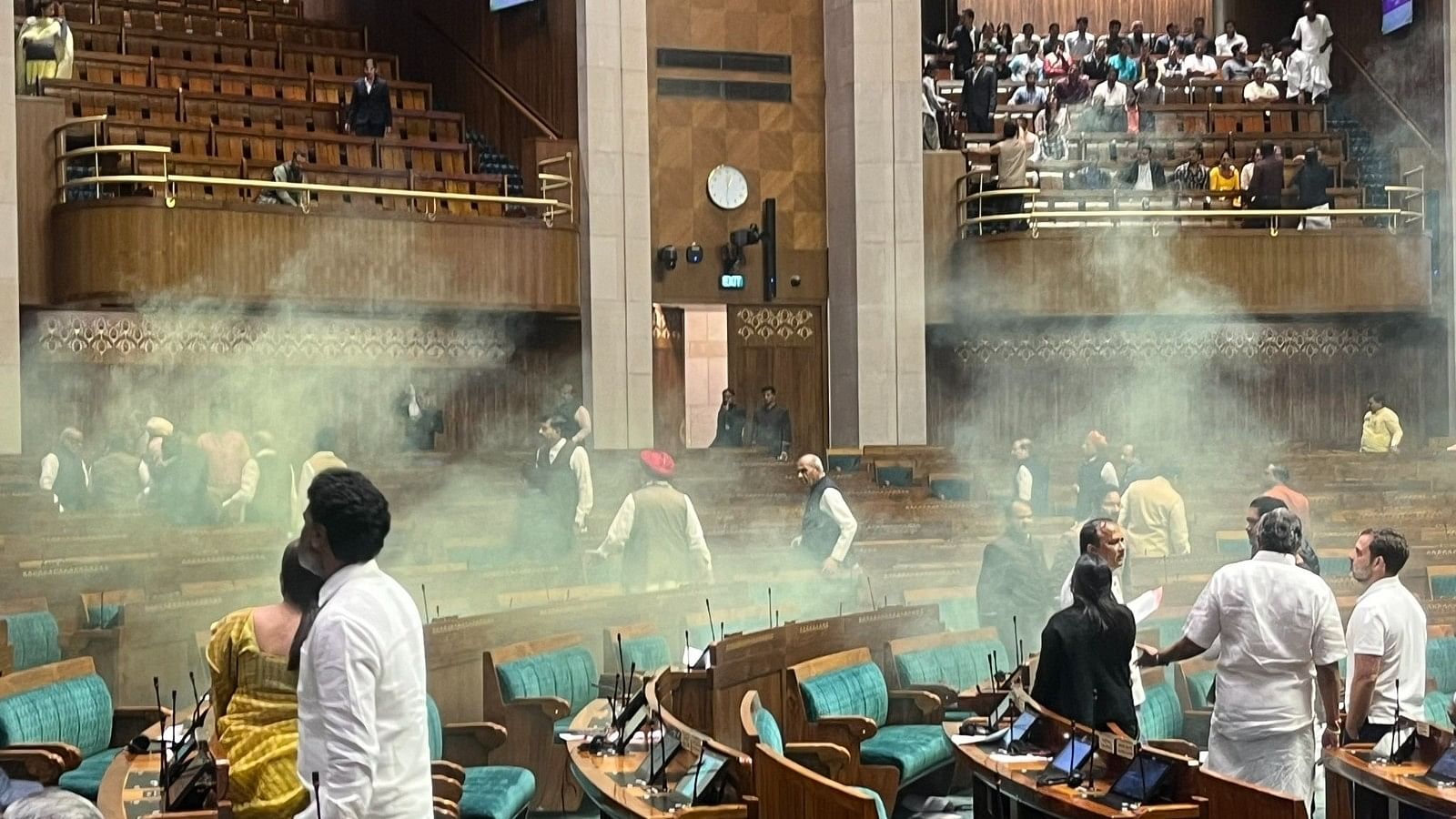 <div class="paragraphs"><p>Two people jumped in the Lok Sabha chamber from the public gallery and set off colured gas canisters during the Winter session of Parliament, in New Delhi, on Wednesday, 13 December 2023.</p></div>