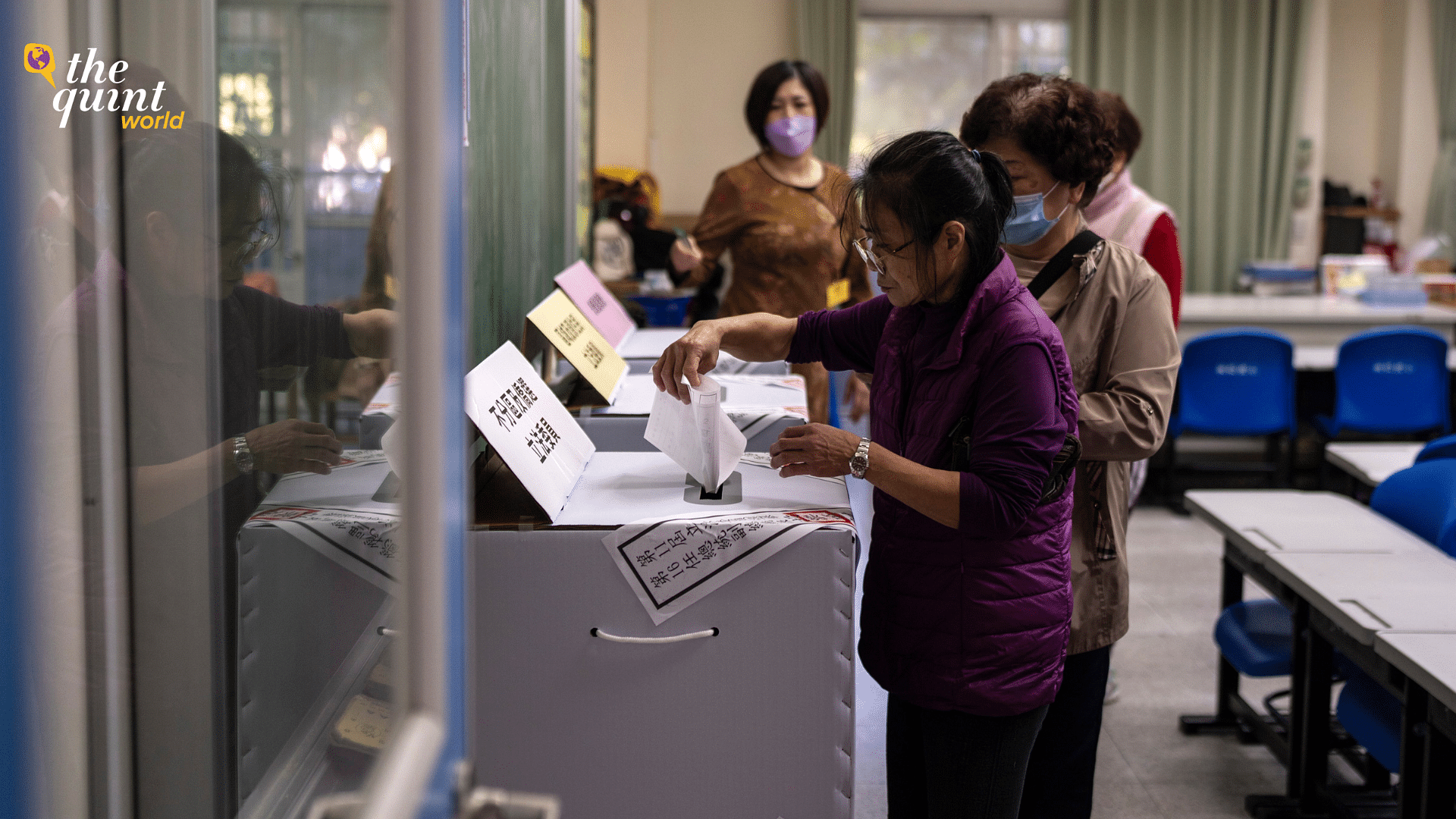 <div class="paragraphs"><p>People cast a vote at a polling station during the elections in New Taipei City Saturday, 13 January, 2024.</p></div>