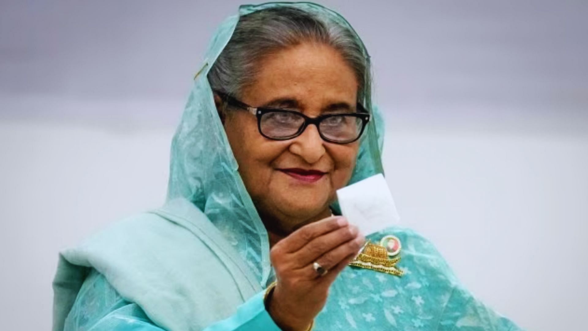 <div class="paragraphs"><p>Bangladesh Prime Minister Sheikh Hasina shows her ballot paper as she casts her vote in Dhaka, Bangladesh, Jan. 7, 2024.</p></div>