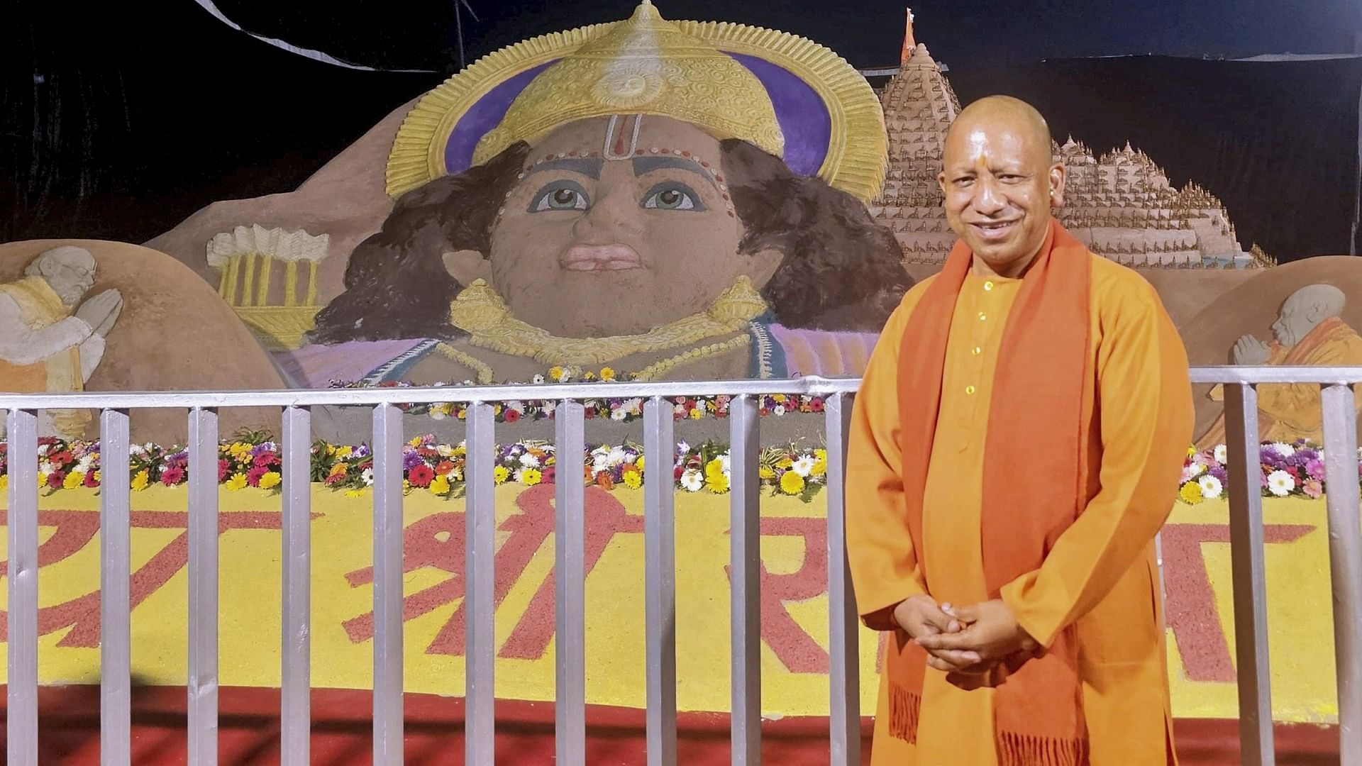 <div class="paragraphs"><p>(CM Yogi Adityanath poses with a sand art exhibit of Lord Ram)</p></div>