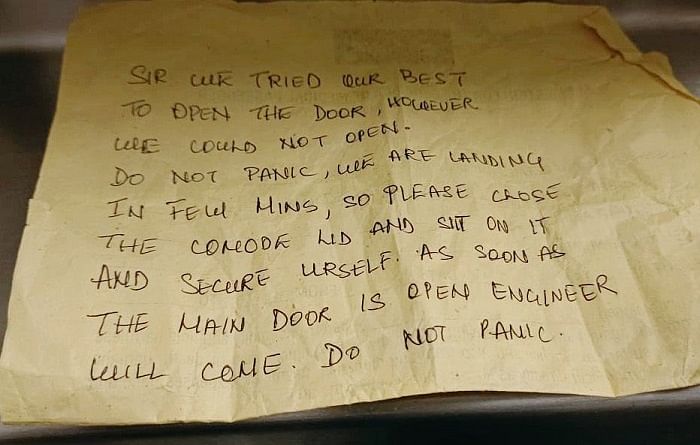 SpiceJet crew slips 'don't panic' note to stuck passenger in toilet, assures help upon landing.