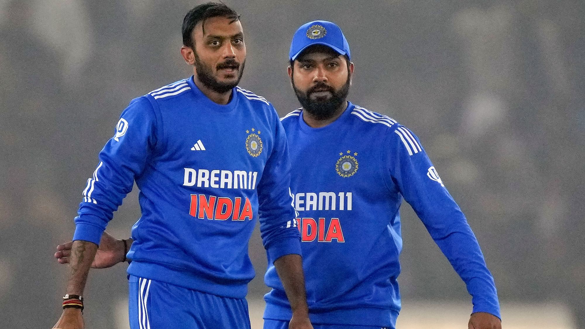 <div class="paragraphs"><p>Axar Patel celebrates with captain Rohit Sharma the wicket of Afghanistan's batter Rahmanullah Gurbaz during the first T20I cricket match between India and Afghanistan, in Mohali, Thursday, Jan. 11, 2024.</p></div>