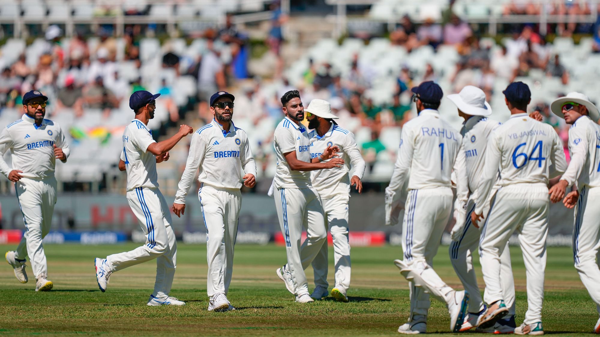 <div class="paragraphs"><p>Mohammed Siraj celebrates with teammates after taking the wicket of South Africa's Aiden Markram on the first day of the second Test cricket match between India and South Africa, at the Newlands Cricket Ground, in Cape Town, South Africa, Wednesday, Jan. 3, 2024.</p></div>