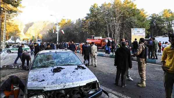 <div class="paragraphs"><p>People gather at the site of an explosion in the city of Kerman, about 510 miles (820 kilometres) southeast of the capital Tehran, Iran.</p></div>