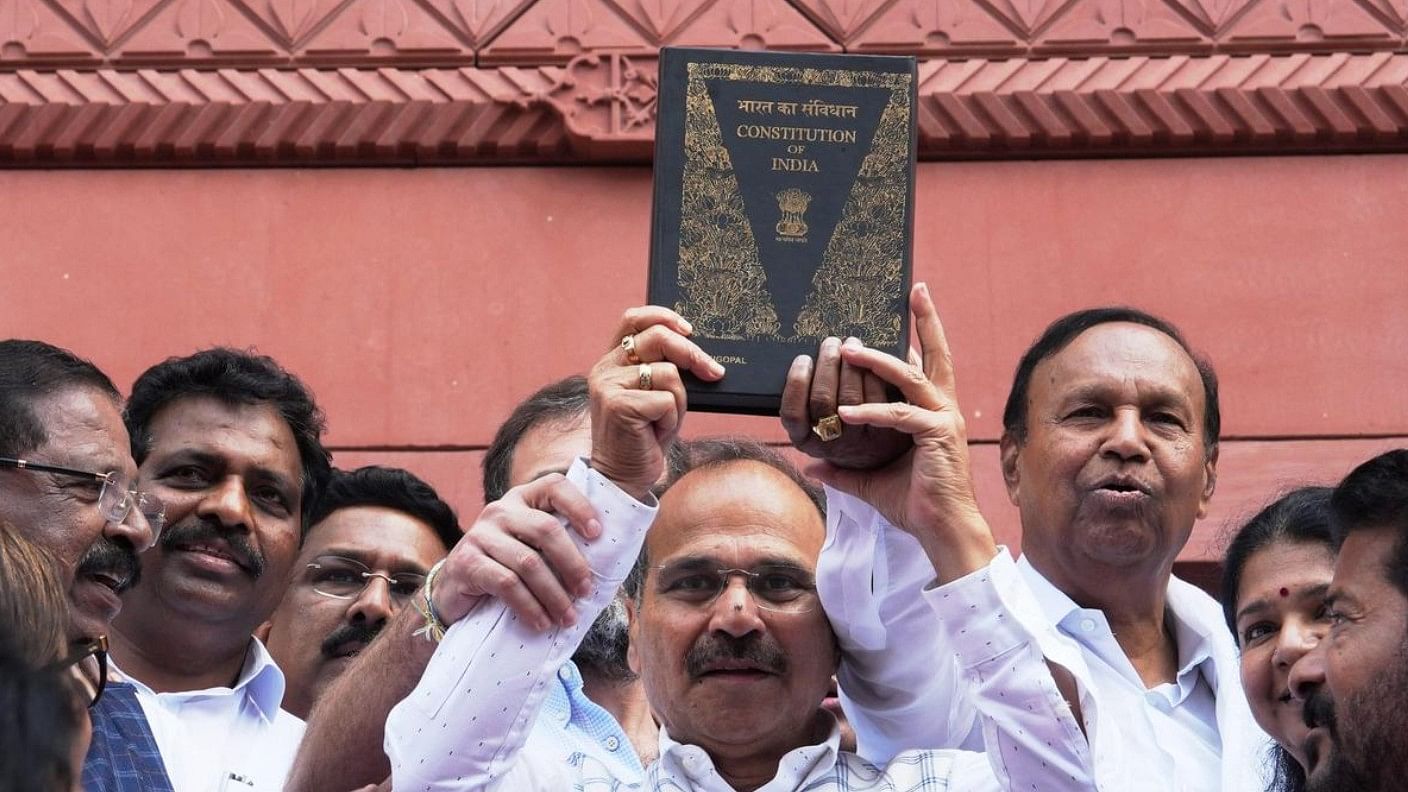 <div class="paragraphs"><p>Congress MP Adhir Ranjan Chowdhury, holding a copy of the Constitution of India, walks towards the new Parliament building, in New Delhi, on September 19, 2023.</p></div>