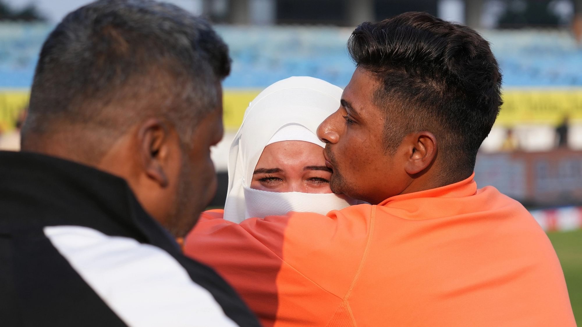 <div class="paragraphs"><p>Sarfaraz Khan of India hugs his wife after receiving his debut Test cap during the first day of the 3rd Test match between India and England at the Niranjan Shah Stadium Rajkot on 15 February 2024</p></div>