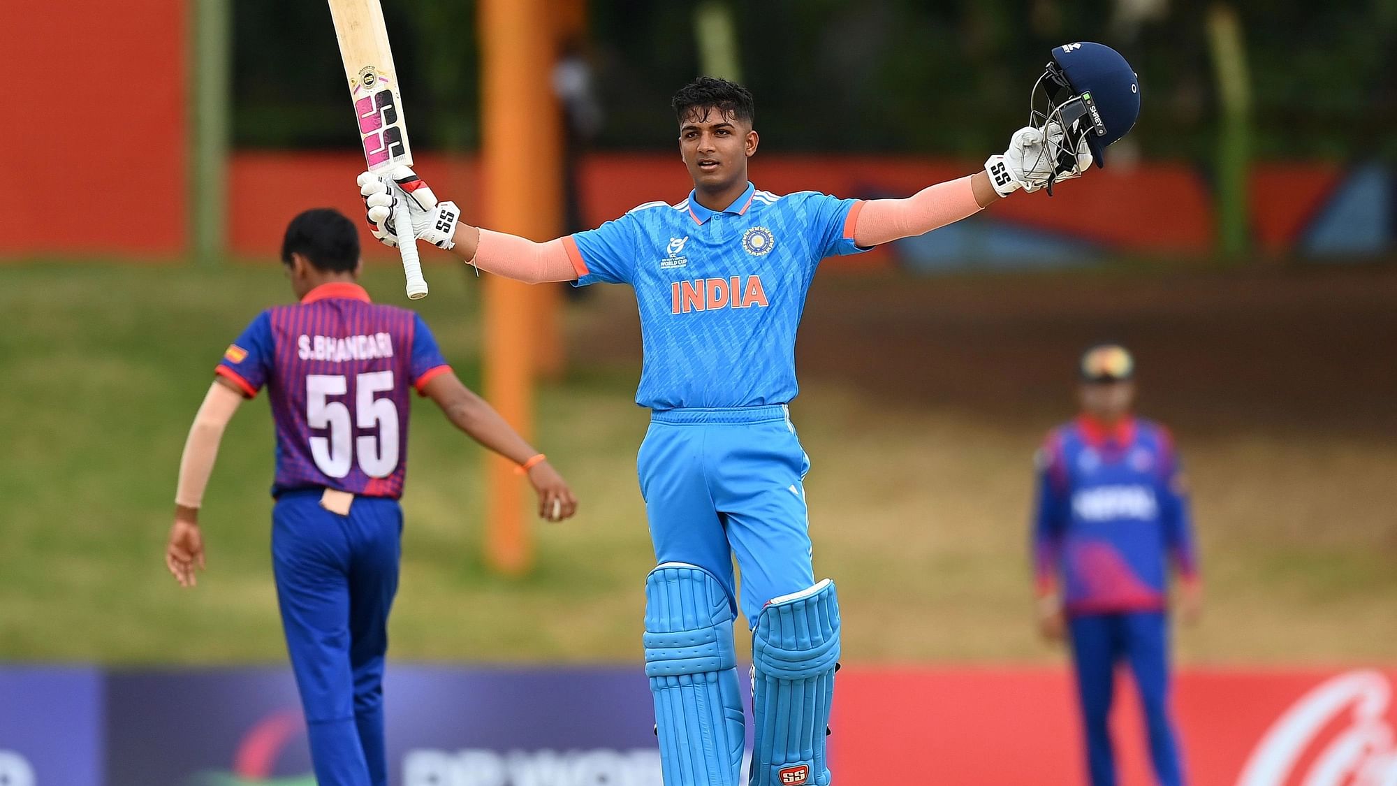 <div class="paragraphs"><p>Sachin dhas ofIndiaraises his bat and helmet as he celebrates after reaching his century during the icc U19 men’s cricket world cupSouth Africa2024 super six match betweenIndiaandNepalat mangaung oval on february 02, 2024.</p></div>