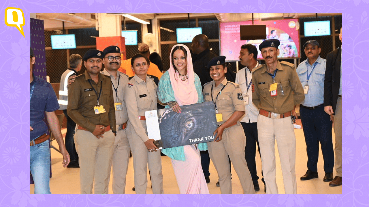 <div class="paragraphs"><p>Rihanna poses with security personnel at the airport before leaving India.</p></div>