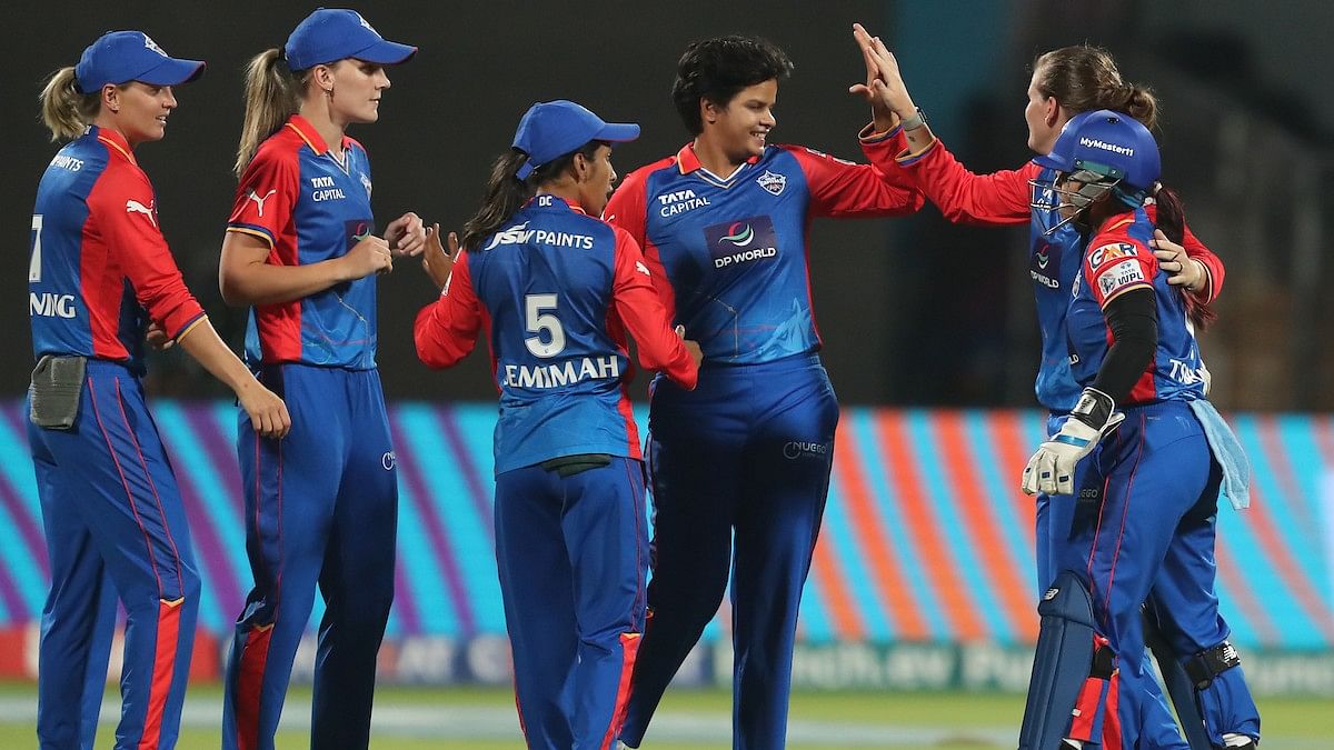 <div class="paragraphs"><p>Jess Jonassen of Delhi Capitals celebrates the wicket of Phoebe Litchfield of Gujarat Giants with players during match ten of the Women’s Premier League 2024 between Gujarat Giants and Delhi Capitals held at the M. Chinnaswamy Stadium on 3 March 2024</p></div>