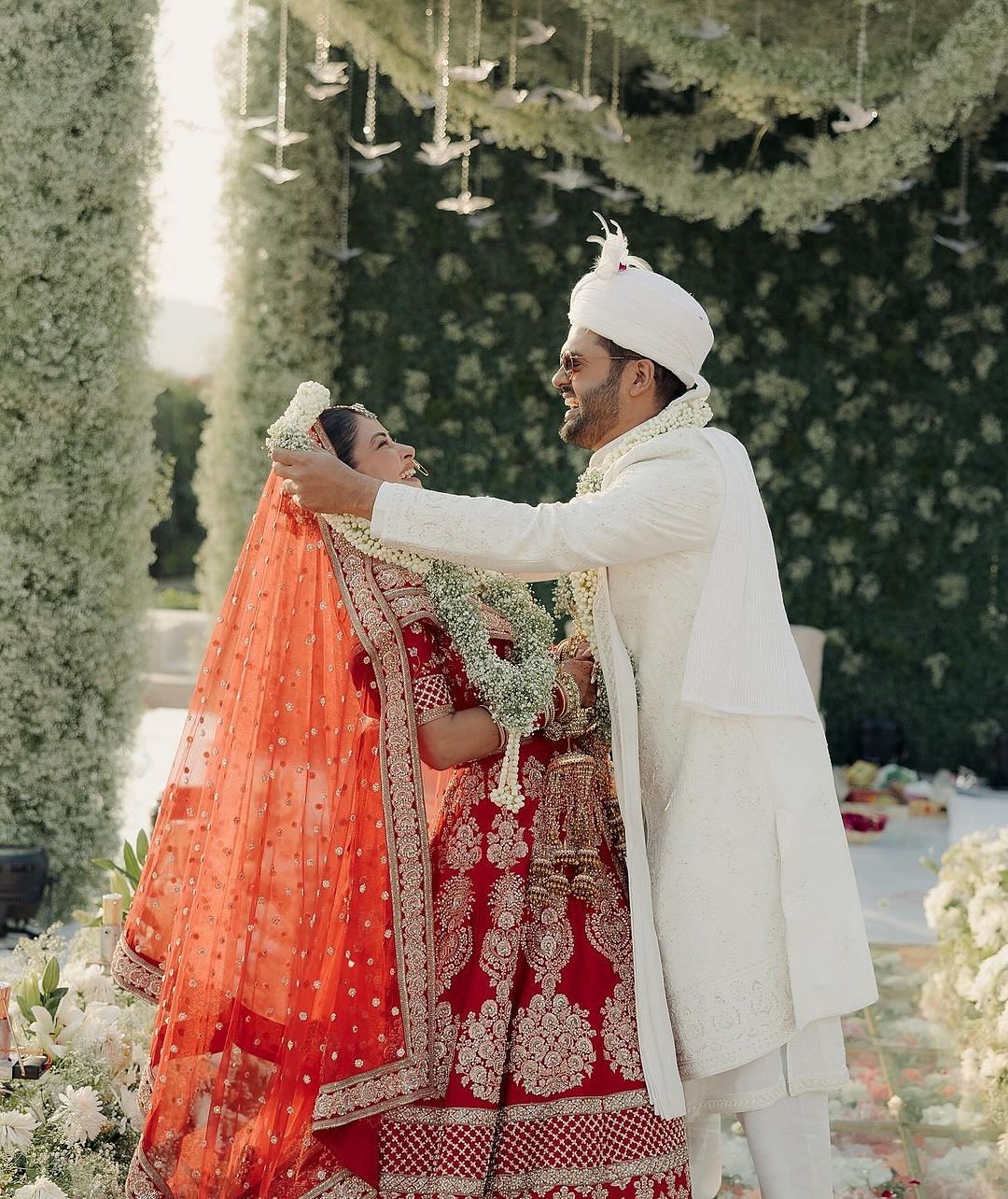 Photo of Red Sabyasachi bridal lehenga and groom | Indian wedding planning,  Indian wedding, Chicago wedding venues