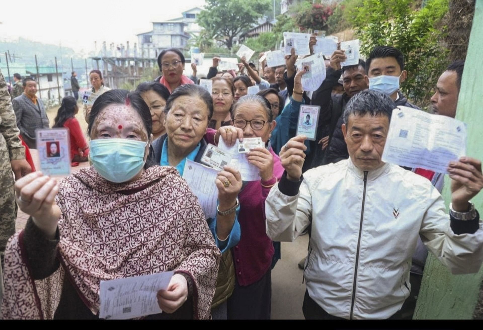 <div class="paragraphs"><p>Namchi: People show their ID cards as they wait to cast their votes during phase 1 of Lok Sabha elections in Sikkim on Friday, 19 April.&nbsp;</p></div>