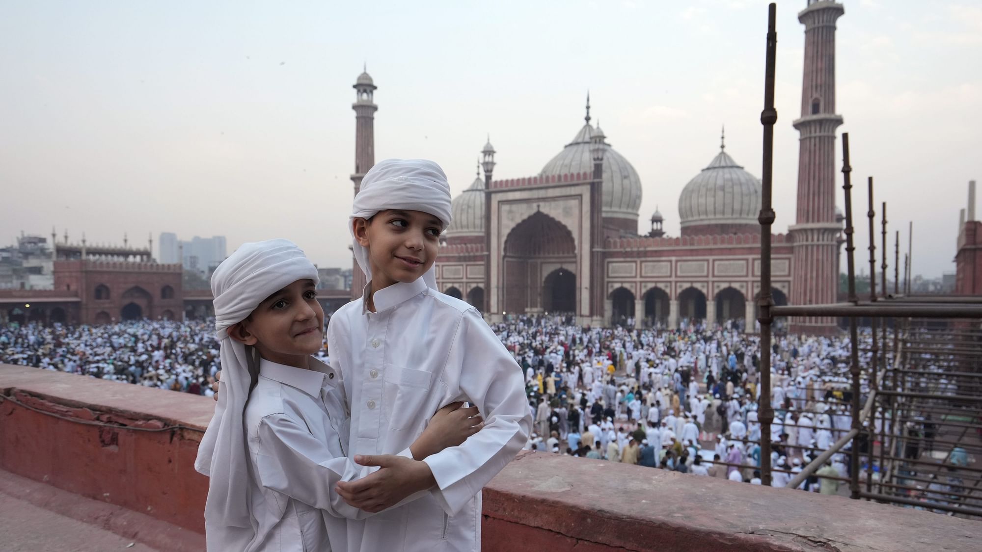 <div class="paragraphs"><p>Children greet each other at the Jama Masjid on the occasion of the Eid-ul-Fitr festival, in New Delhi, Thursday, 11 April.</p></div>
