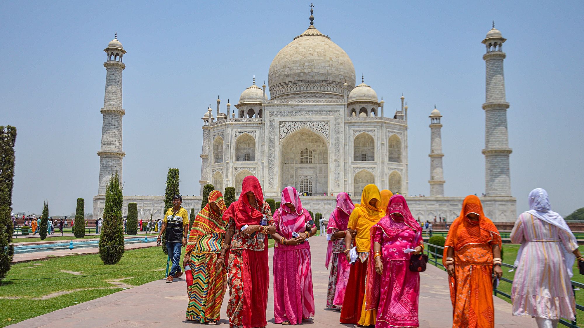 <div class="paragraphs"><p>Tourists at the Taj Mahal on a hot summer day in Agra on Tuesday, 21 May, 2024.</p></div>