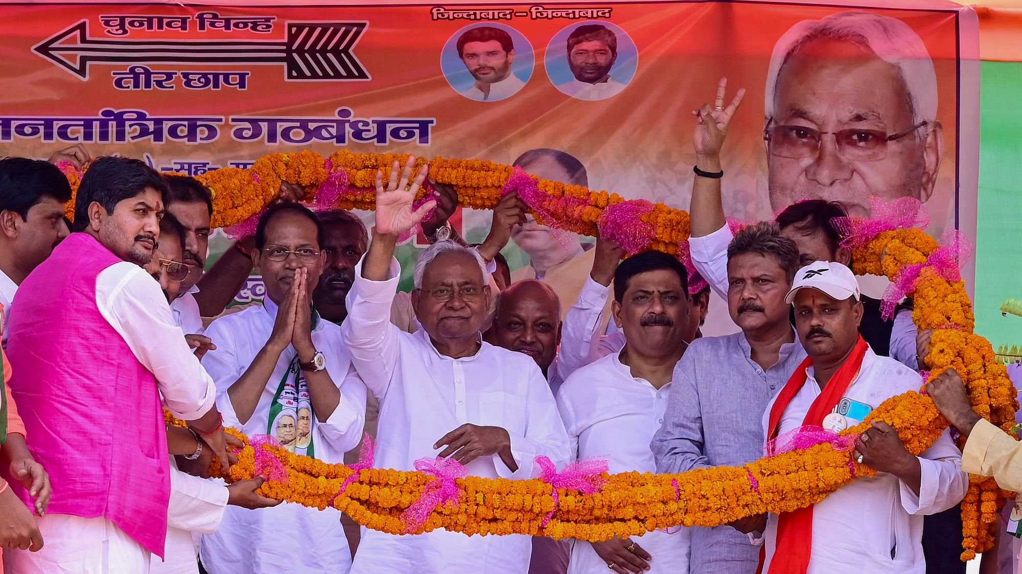 <div class="paragraphs"><p>Gopalganj: Bihar Chief Minister Nitish Kumar and other leaders being garlanded during a public meeting for Lok Sabha elections, in Gopalganj, Sunday, May 12, 2024. </p></div>