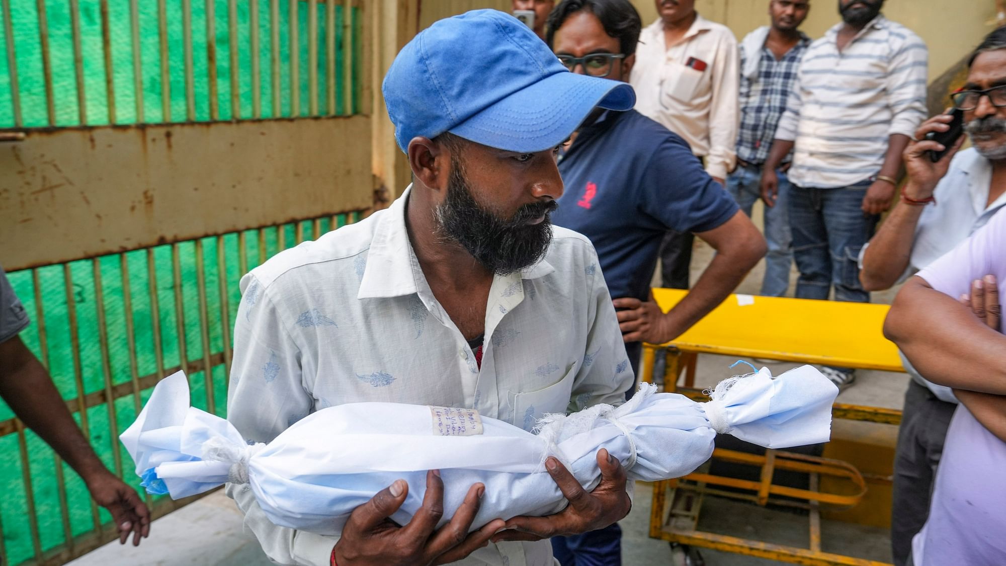 <div class="paragraphs"><p>Rajkumar, who works as a gardener, at GTB Hospital’s mortuary after he received his 17-day-old daughter's body.</p></div>