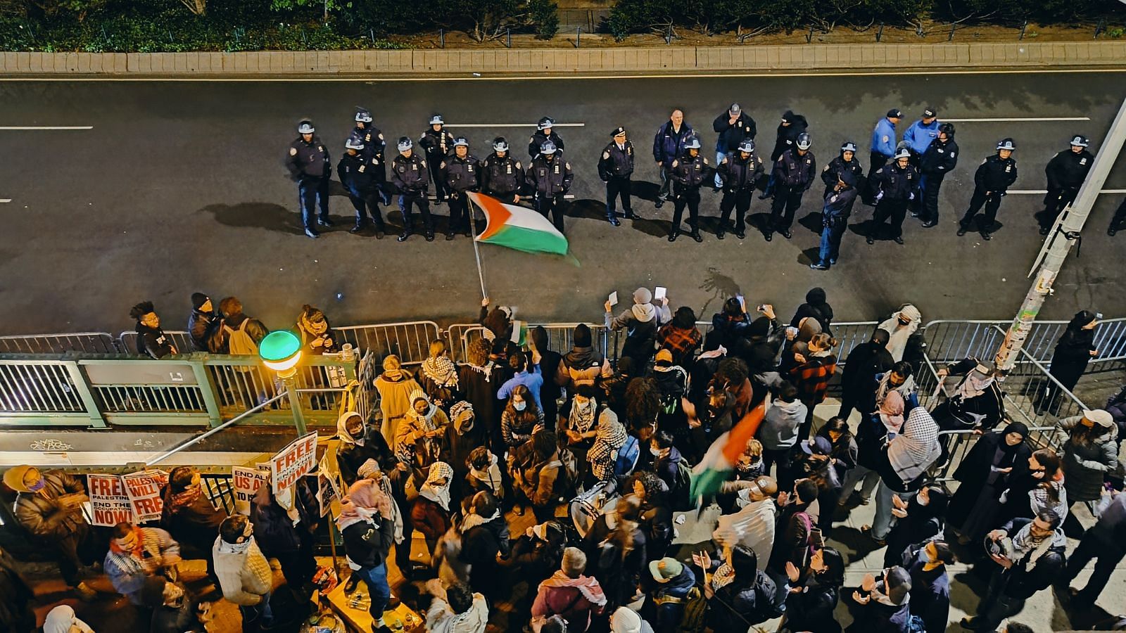 <div class="paragraphs"><p><em>Police officials watch over a pro-Palestine protest outside the gates of Columbia University in New York City.</em></p></div>