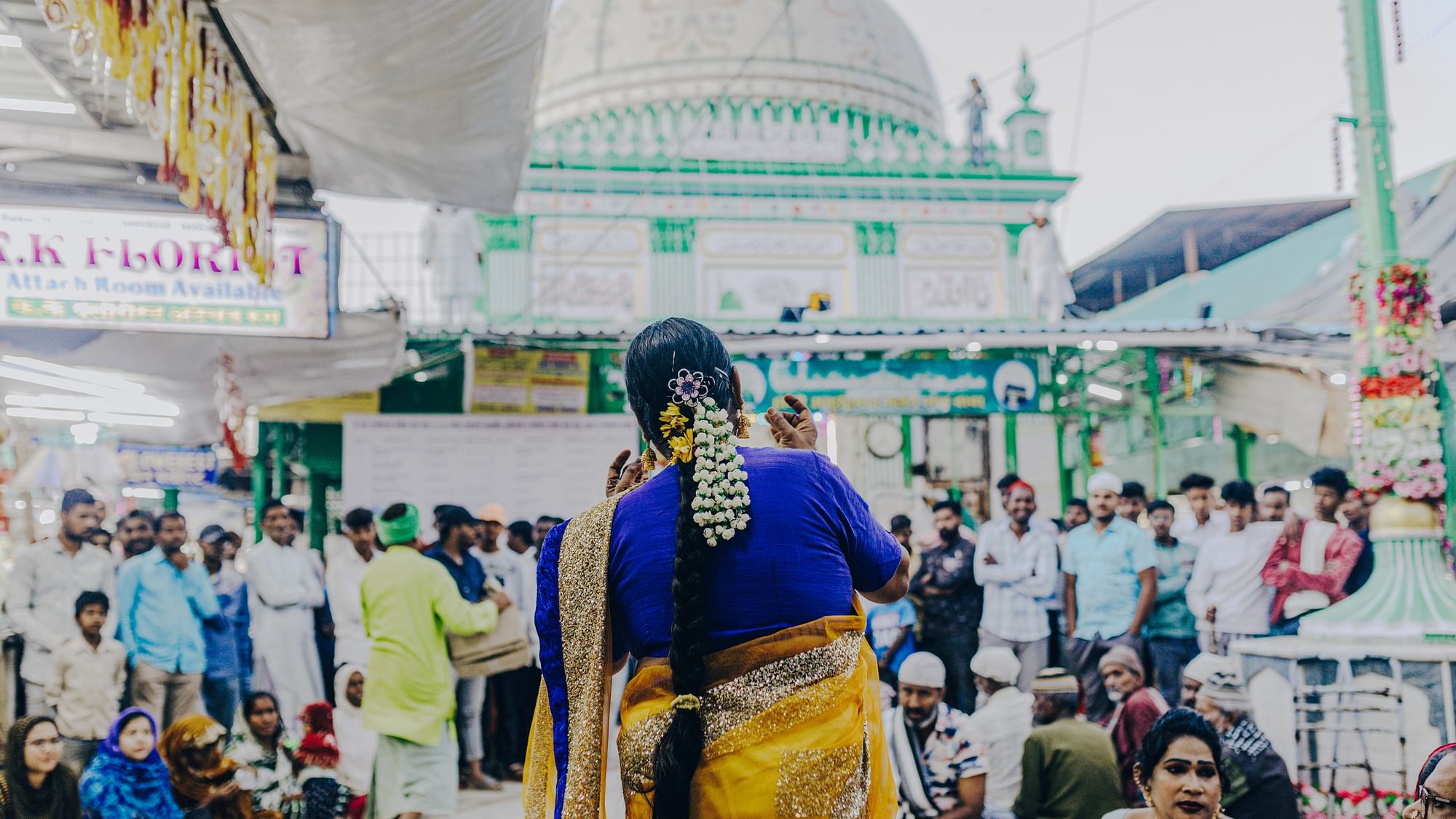 <div class="paragraphs"><p>A member of a kinnar group performing at the main shrine of the Haji Malang Dargah seeking alms.</p></div>