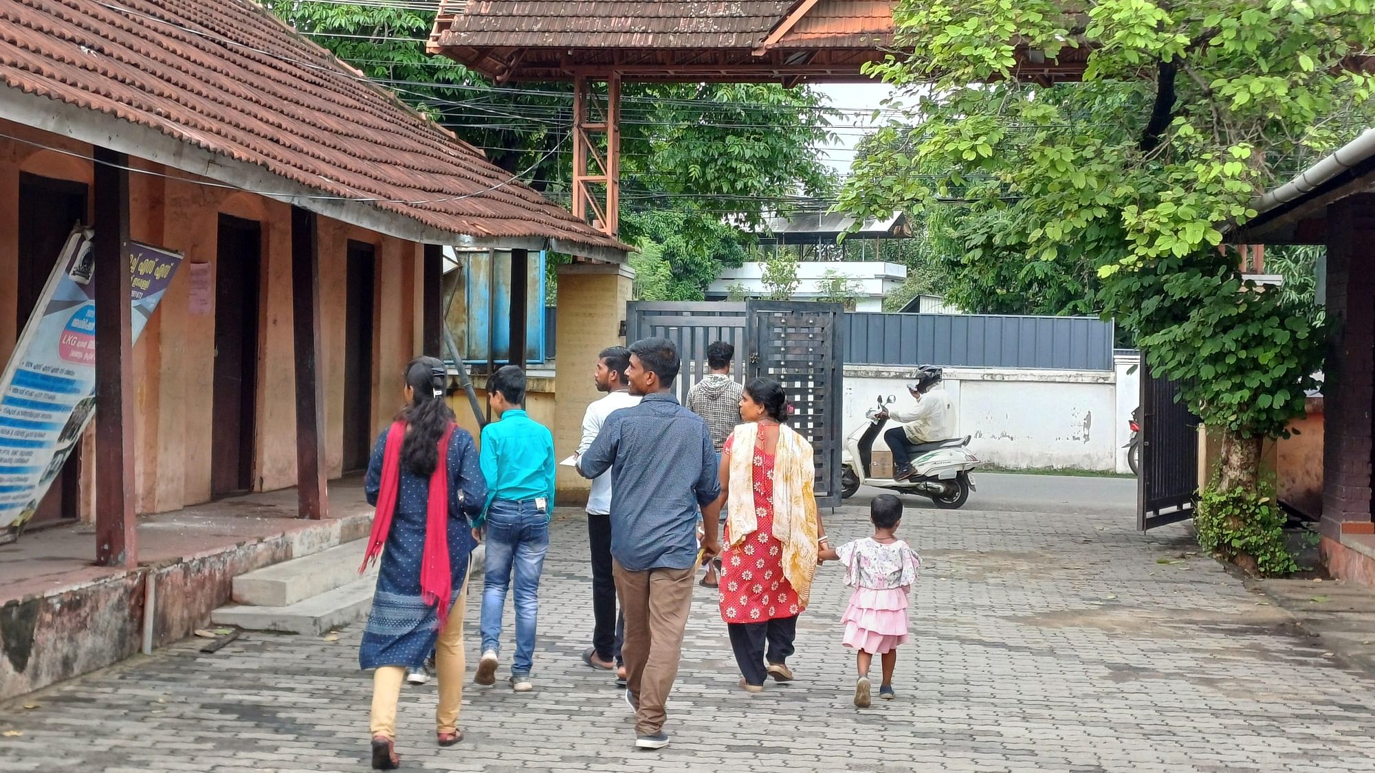 <div class="paragraphs"><p>A migrant family returning from a school in the Ernakulam district after enrolling their children for the academic year.</p></div>