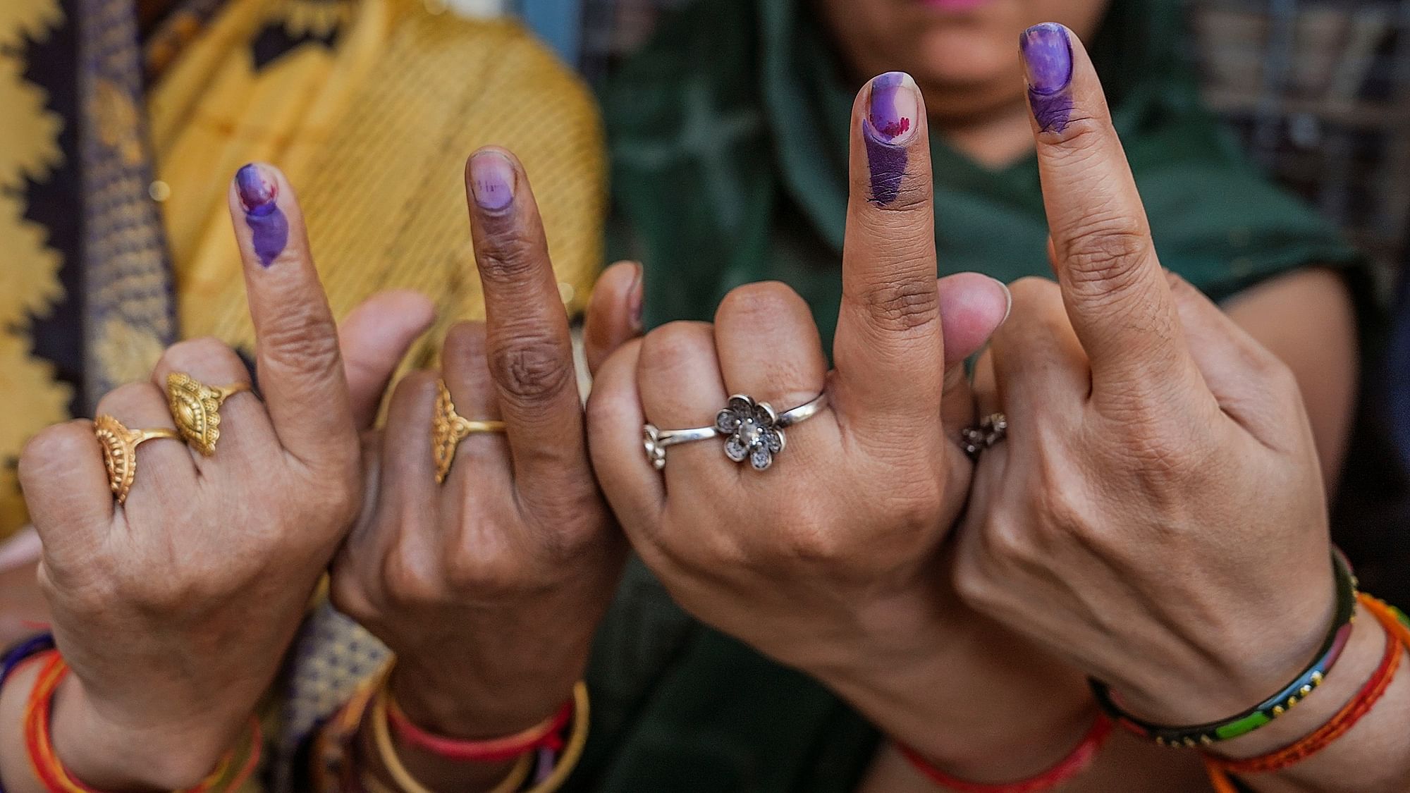 <div class="paragraphs"><p>Voters show their fingers marked with indelible ink after casting votes for the third phase of Lok Sabha elections, in Hathras, Uttar Pradesh on Tuesday, 7 May.</p><p>&nbsp;</p></div>