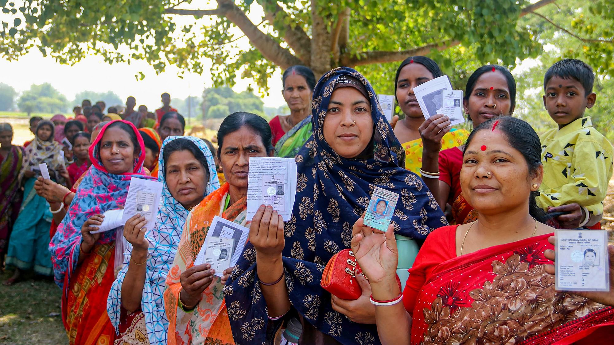 <div class="paragraphs"><p>Image used for representation only. South Dinajpur: Women voters show their ID cards as they wait to cast their votes for the second phase of Lok Sabha elections. Image used for representation only.&nbsp;</p></div>