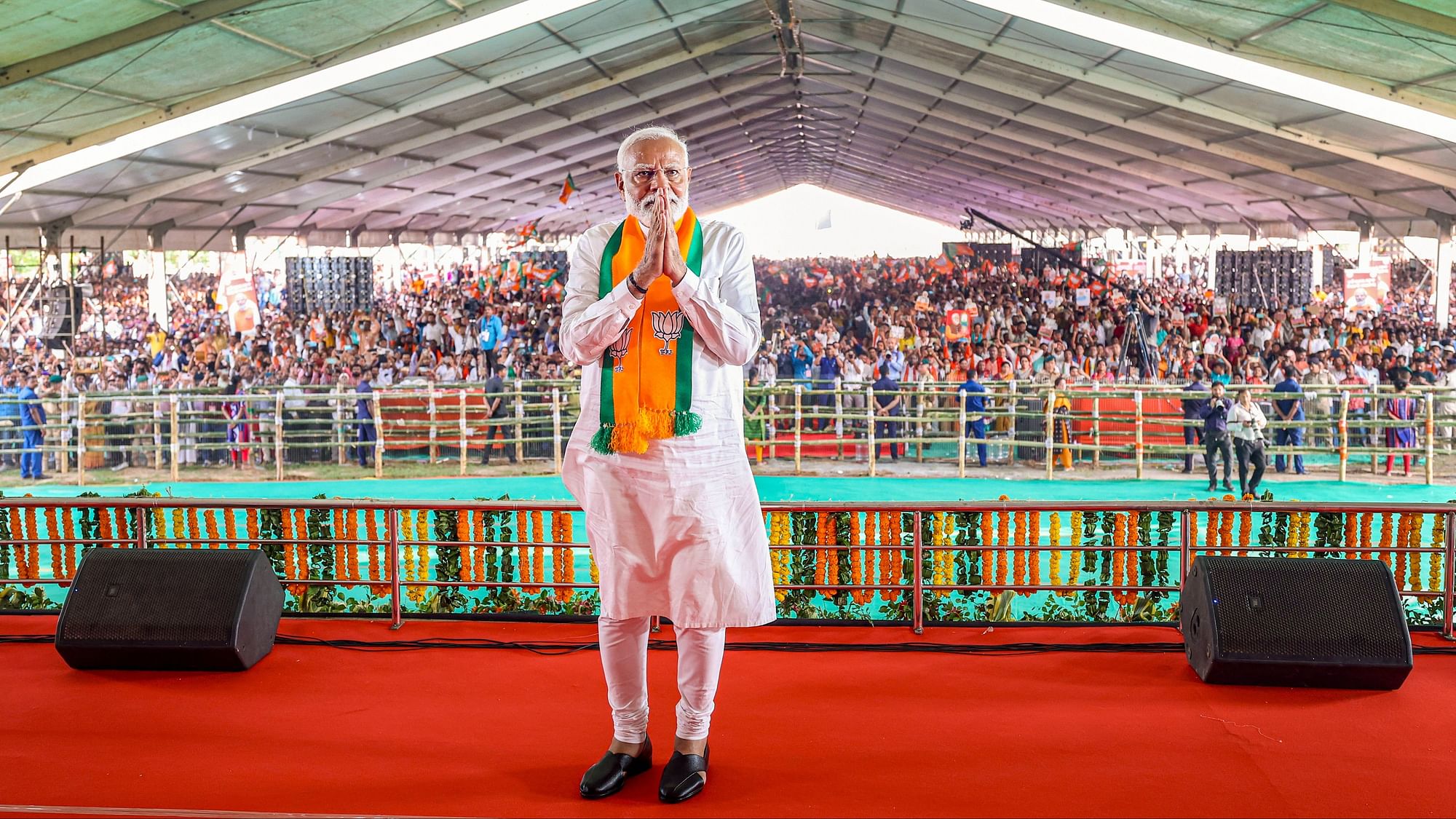 <div class="paragraphs"><p> Prime Minister Narendra Modi greets others during a public meeting ahead of the seventh phase of Lok Sabha elections, in Kendrapara district, Wednesday, May 29, 2024.  </p></div>