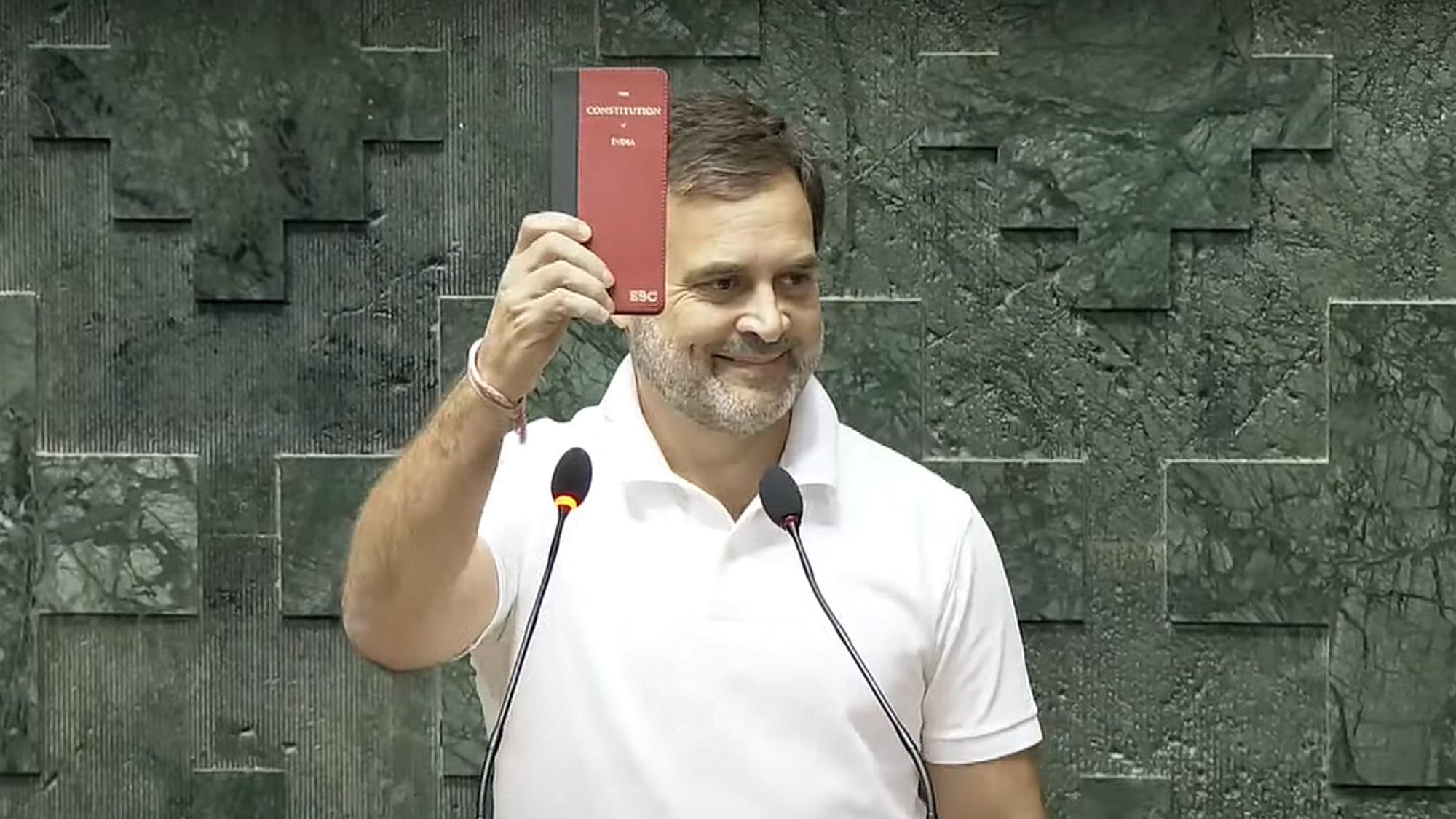 <div class="paragraphs"><p>New Delhi: Congress MP Rahul Gandhi shows a copy of the Constitution of India as he takes oath as a member of the House during the first session of the 18th Lok Sabha, in New Delhi, Tuesday, June 25, 2024.</p></div>