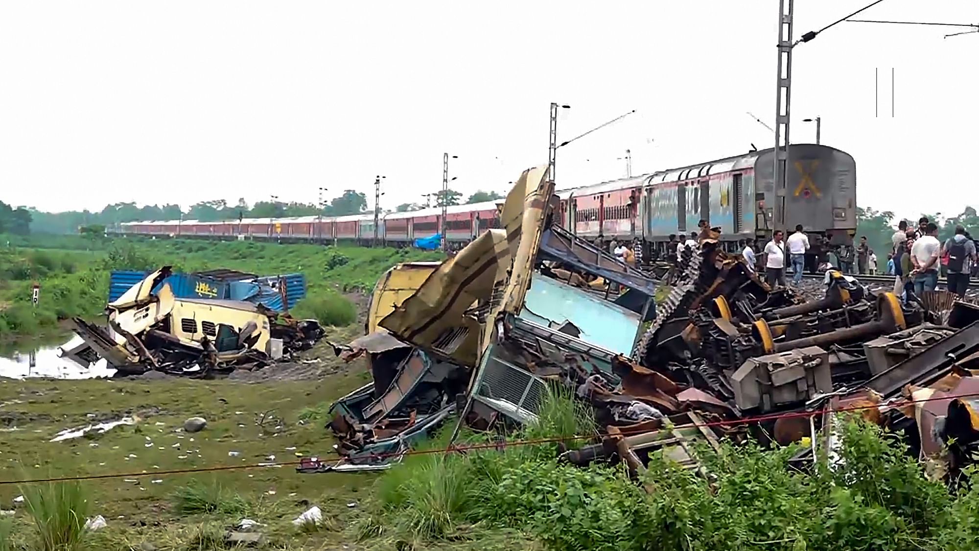 <div class="paragraphs"><p>New Jalpaiguri: A train runs through the accident area following restoration of services a day after the collision between the Kanchanjunga Express and a goods train, near Rangapani railway station, Tuesday, June 18, 2024. Atleast 10 people died and several others were injured in the accident, according to officials.</p></div>