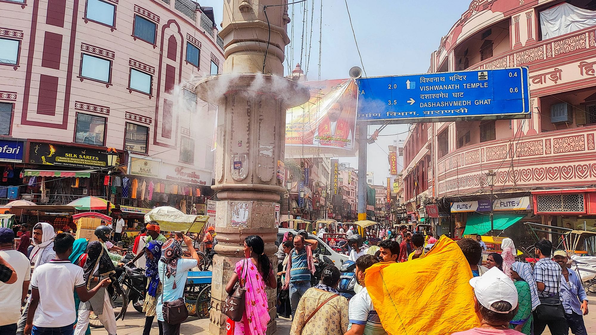 <div class="paragraphs"><p>Varanasi: Cooling water mist being released to provide relief from the scorching heat on a hot summer day, at Godaulia, in Varanasi, Wednesday, June 12.</p></div>