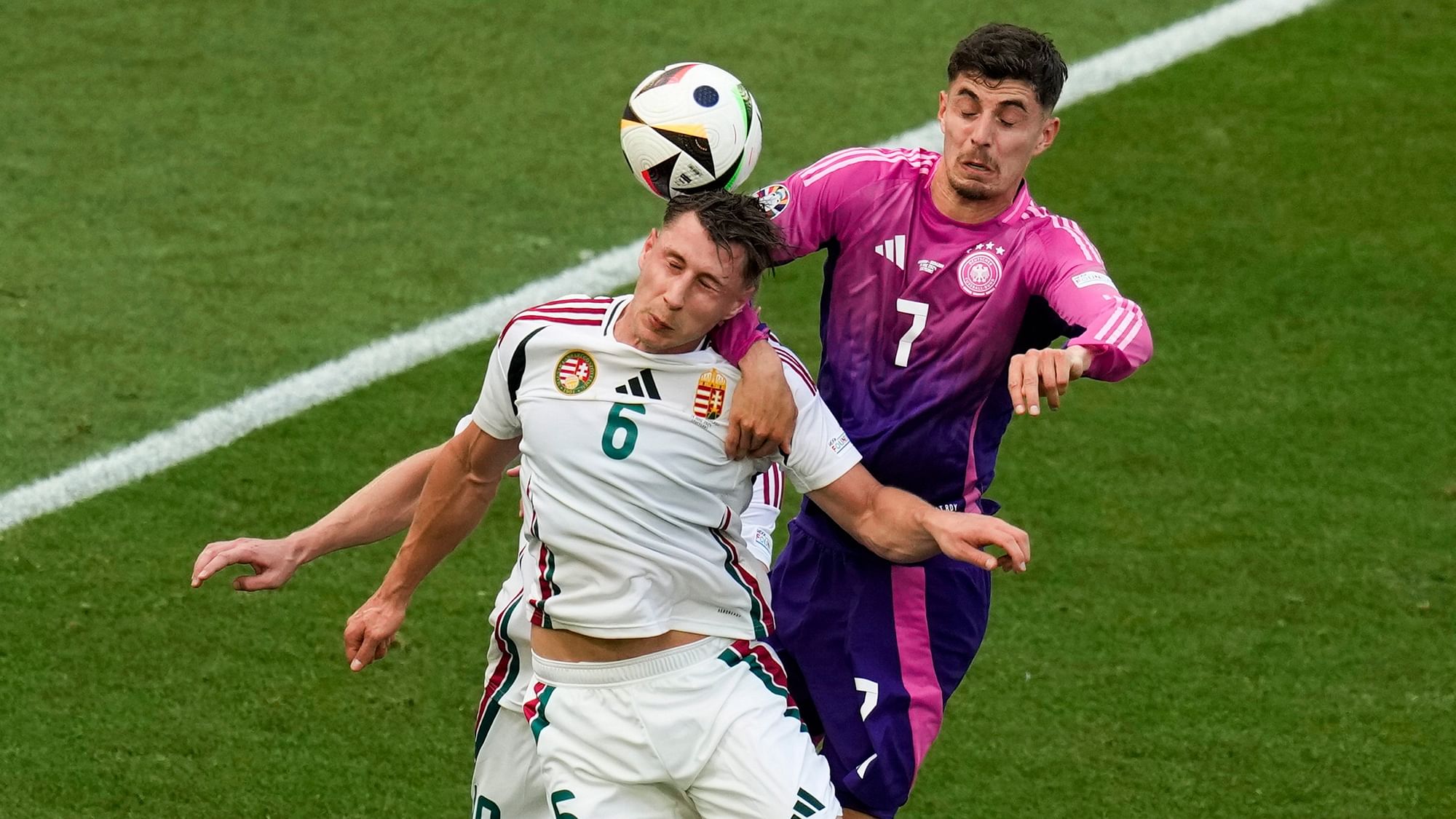 <div class="paragraphs"><p>Hungary's Barnabas Varga (19), Willi Orban (6), and Germany's Kai Havertz (7) head the ball during a Group A match between Germany and Hungary at the Euro 2024 soccer tournament in Stuttgart, Germany, Wednesday</p></div>