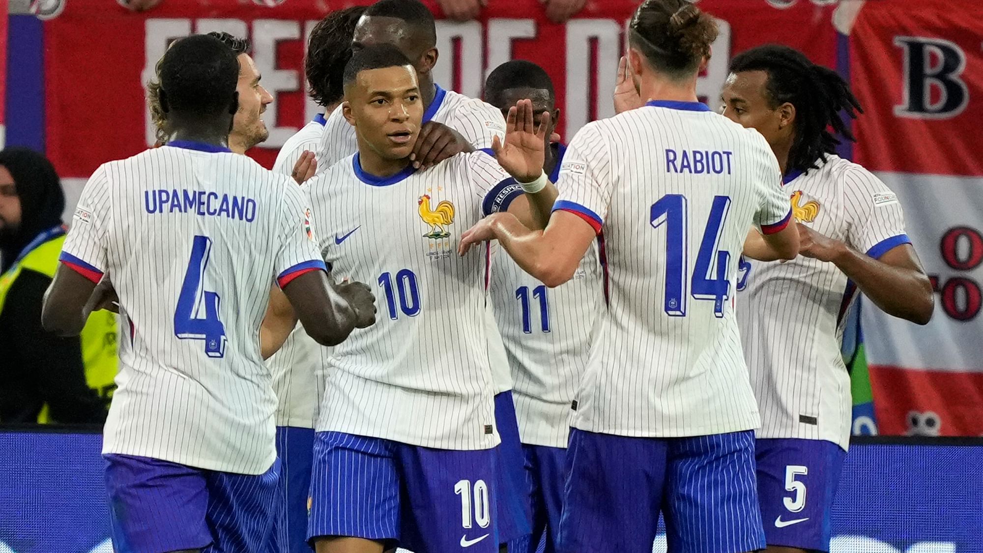 <div class="paragraphs"><p>Kylian Mbappe of France, center, celebrates with teammates after Austria's Maximilian Wober scored an own goal during a Group D match between Austria and France at the Euro 2024 soccer tournament in Duesseldorf, Germany, Monday, 17 June, 2024.</p></div>