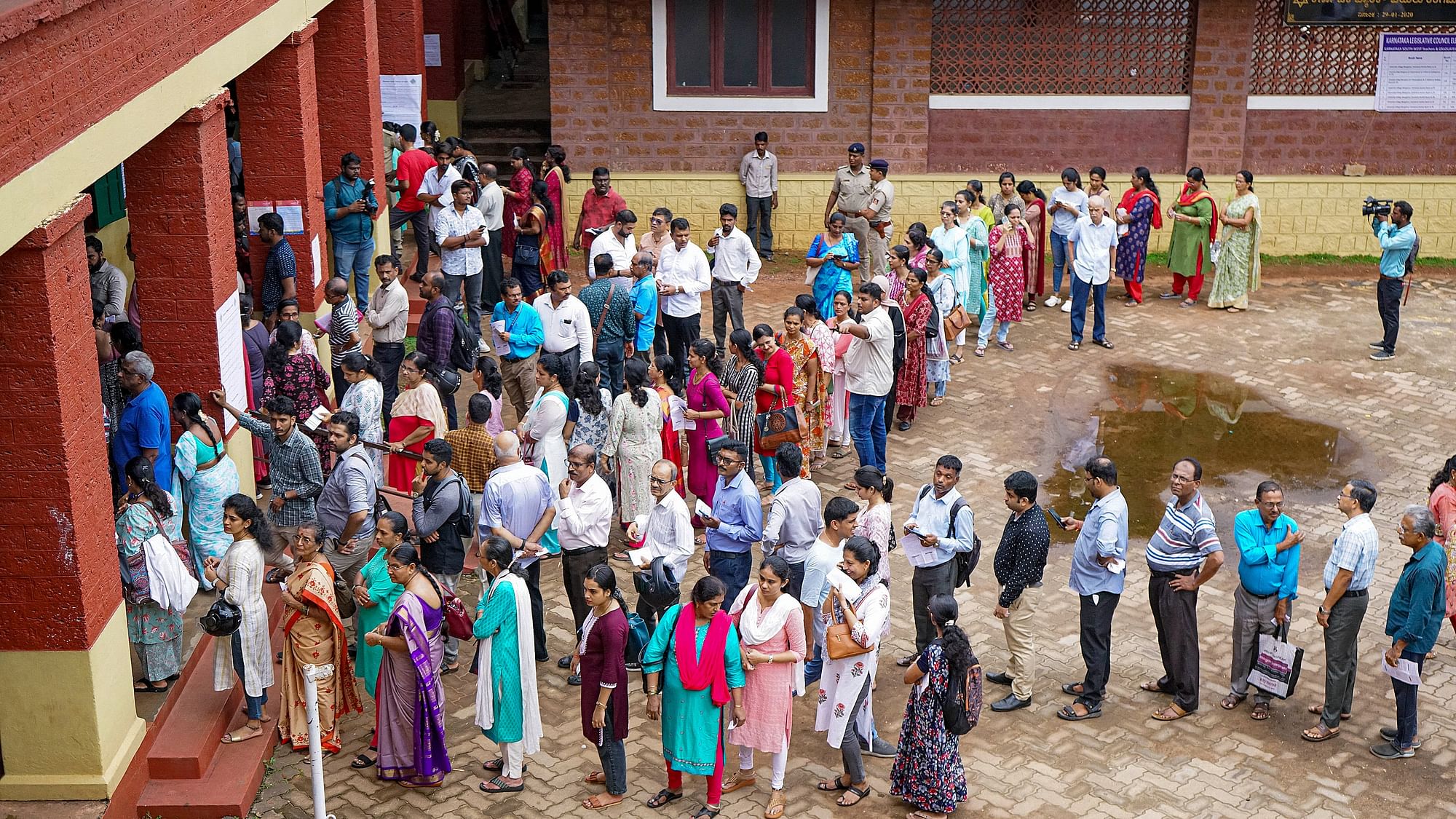 <div class="paragraphs"><p>Mangaluru: Voters wait to cast their vote for the biennial Member of Legislative Council (MLC) elections, in Mangaluru, Karnataka, Monday, June 3, 2024.</p></div>