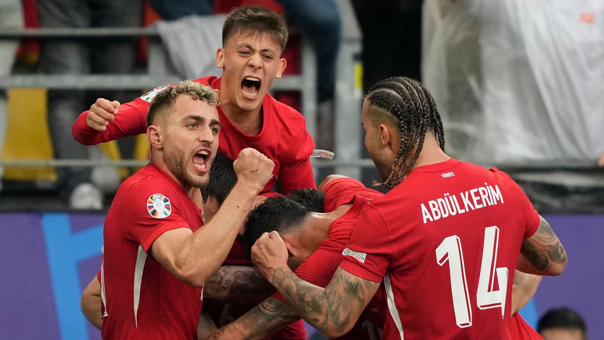 <div class="paragraphs"><p>Turkey's Mert Muldur celebrates with team mates after scoring his sides opening goal during a Group F match between Turkey and Georgia at the Euro 2024 soccer tournament in Dortmund, Germany, Tuesday, 18 June, 2024.</p></div>