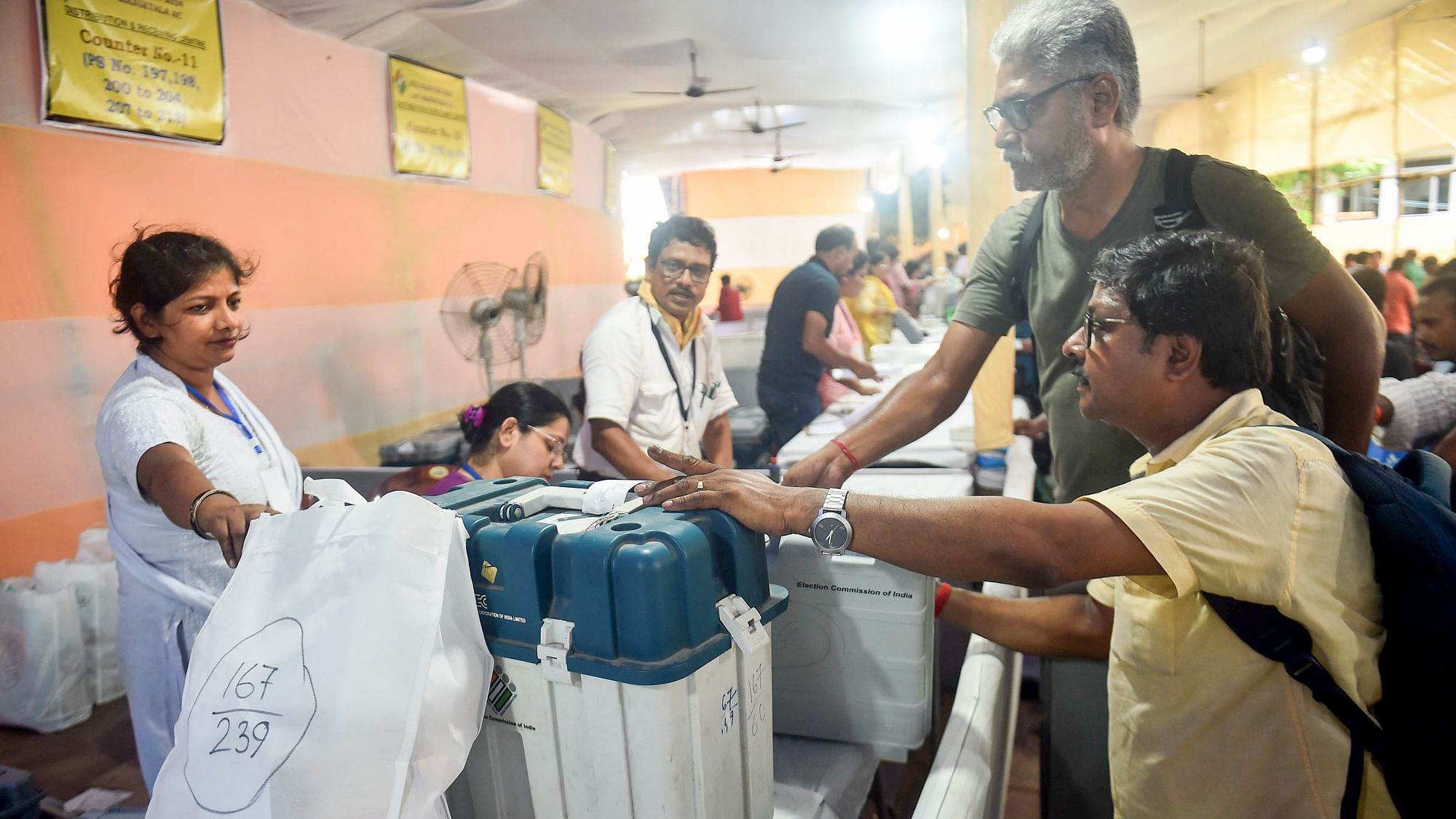 <div class="paragraphs"><p>Kolkata: Polling officials collect EVM and other election materials at a distribution centre for the Maniktala Assembly bypoll, in Kolkata, Tuesday, July 9, 2024.</p></div>