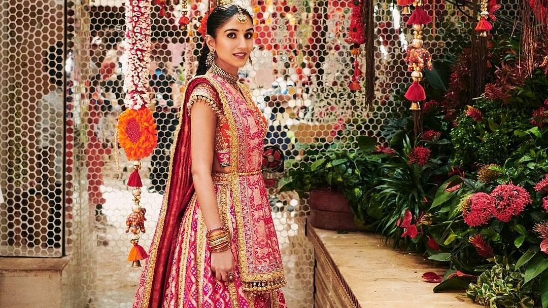 <div class="paragraphs"><p>Radhika Merchant's pre-wedding festivities have been a fashion highlight, with her mameru ceremony outfit standing out.</p></div>