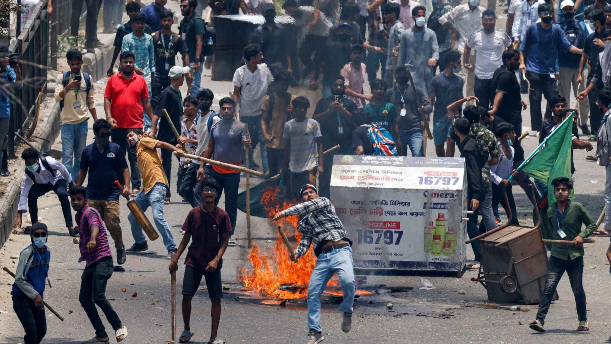 <div class="paragraphs"><p>Anti-quota supporters clash with police and Awami League supporters in Dhaka, Bangladesh. </p></div>