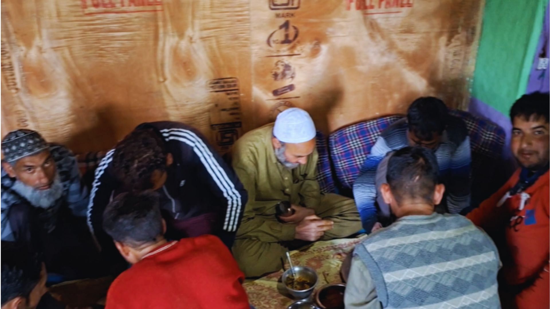 <div class="paragraphs"><p><em>Locals eating together after helping their neighbours in construction of their house. This was an important part of Pashto culture which is fading away.</em></p></div>