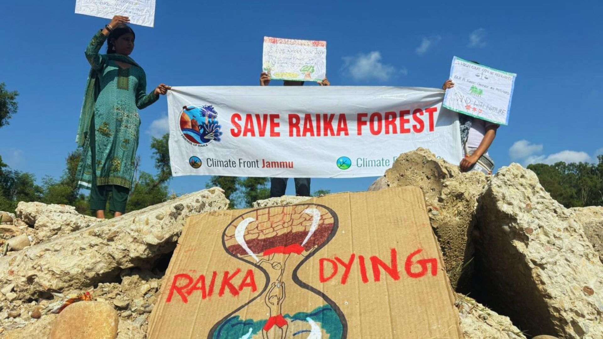 <div class="paragraphs"><p>Protestors holding 'Save Raika Forest' banners in Jammu.</p></div>