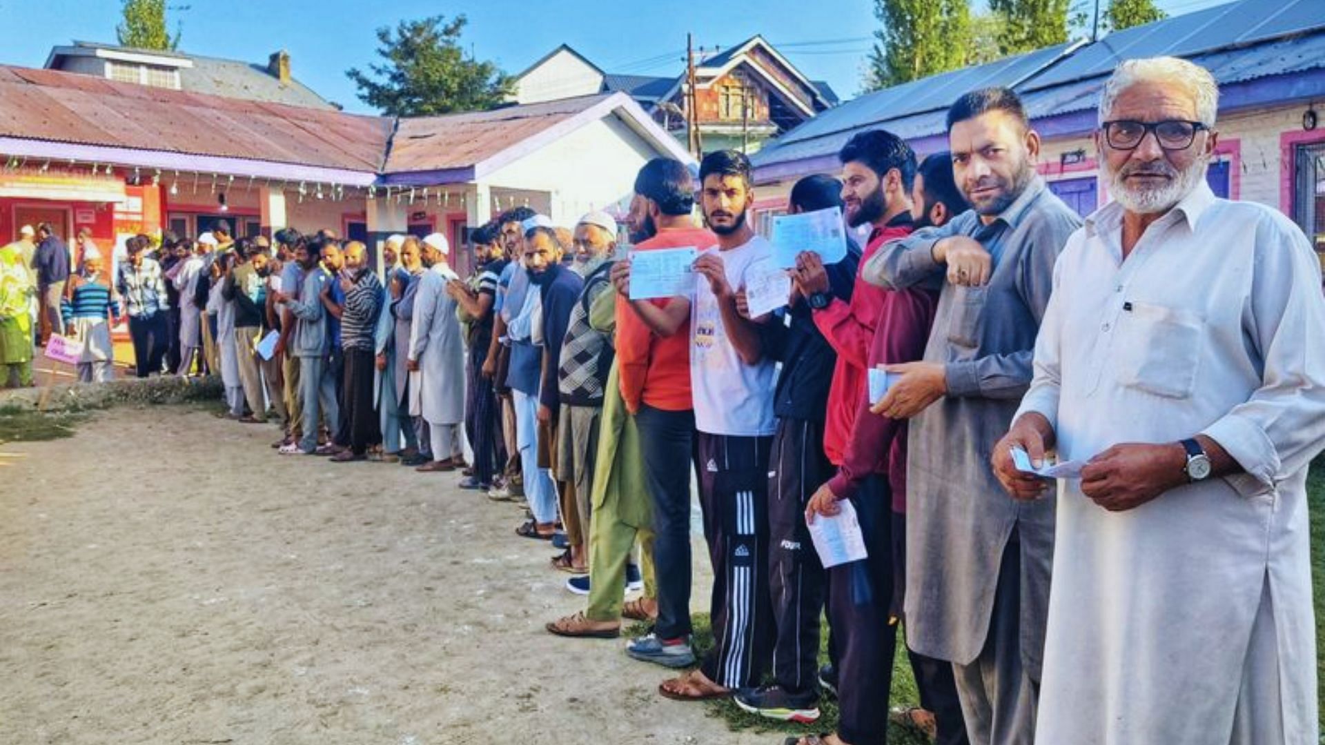 <div class="paragraphs"><p>Voters queue up outside a polling booth in Jammu and Kashmir's Pulwama.</p></div>