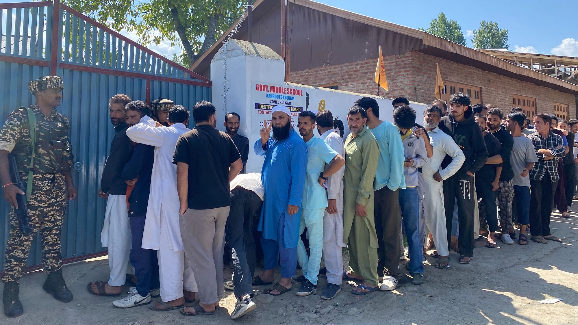 <div class="paragraphs"><p>Voters queued up outside a polling booth in Kahrote village in Kulgam.</p></div>