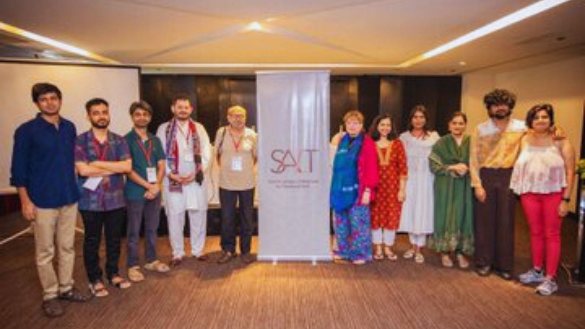 <div class="paragraphs"><p>A photo of the entire cohort of the SALT Hindi-Urdu workshop for 2024 after their final presentation pictured with Asghar Wajahat and Daisy Rockwell.</p></div>