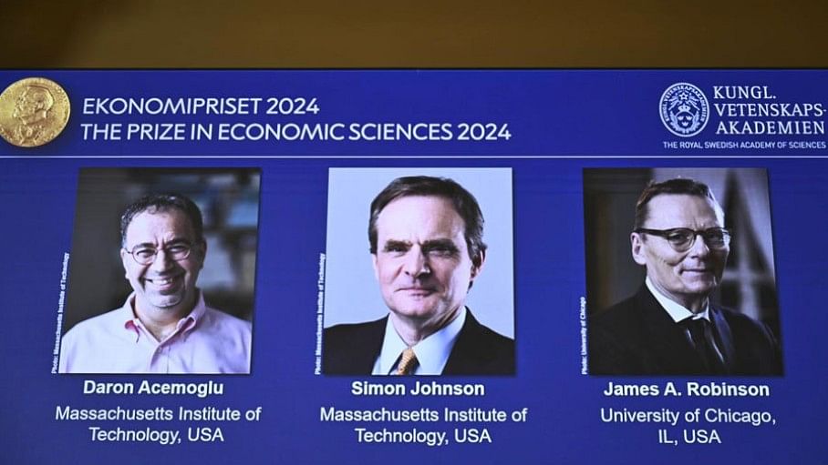 <div class="paragraphs"><p>The Nobel Memorial Prize in economics awarded to Daron Acemoglu, Simon Johnson and James A Robinson, seen on screen, during a press meeting at the Royal Swedish Academy of Sciences in Stockholm, Sweden, Monday, Oct. 14, 2024.</p></div>