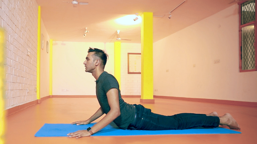 A stiff back can render you useless. Give these simple asanas a shot. 